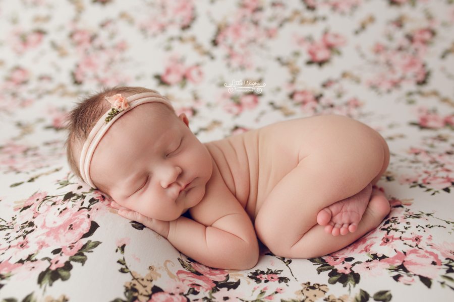 baby girl on flower backdrop, newborn photographers