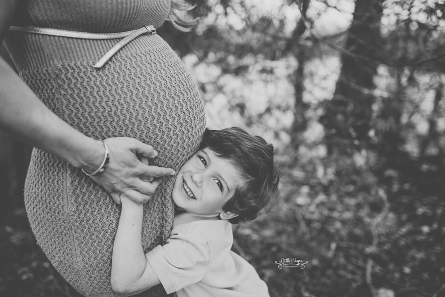 boy hugging mom's belly, maternity photographer ottawa