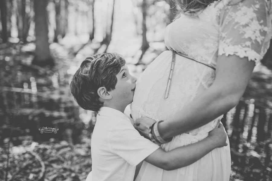 boy kissing mom's belly, pregnancy photos ottawa